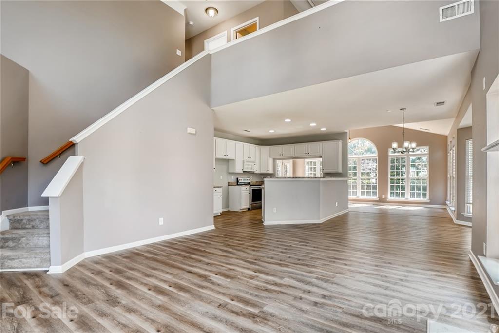 4912 Missi Lane Fort Mill, SC 29708 - Photo 5 of 33 a view of kitchen and kitchen with wooden floor