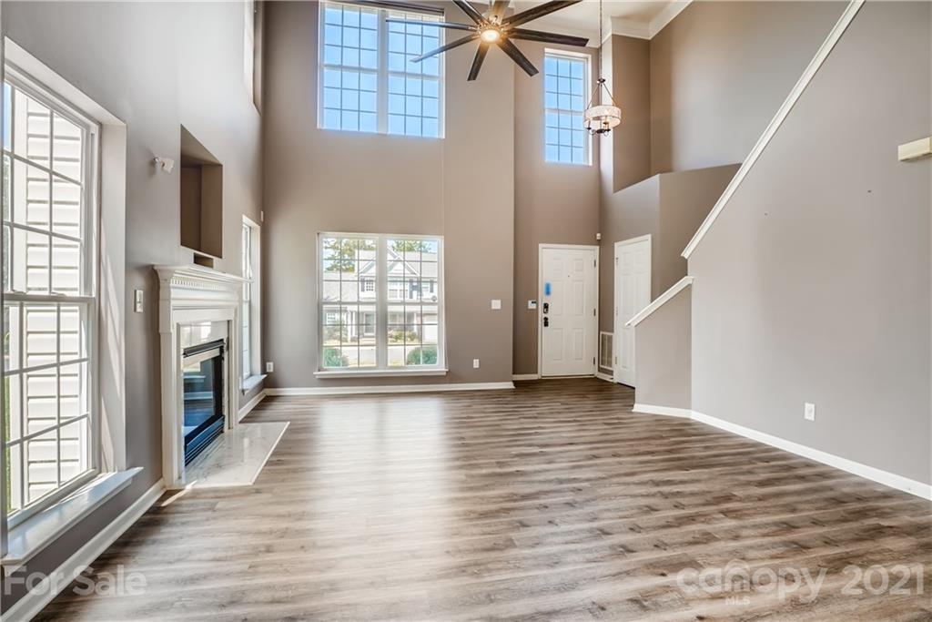 4912 Missi Lane Fort Mill, SC 29708 - Photo 7 of 33 a view of an empty room with wooden floor and a window