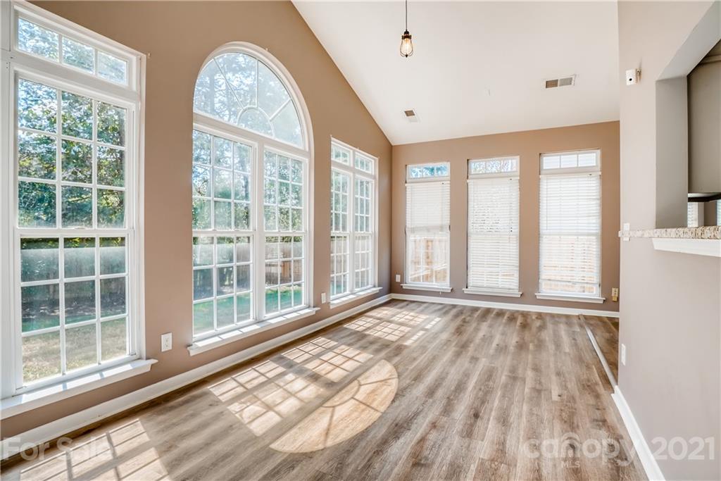 4912 Missi Lane Fort Mill, SC 29708 - Photo 9 of 33 a view of an empty room with wooden floor and a window