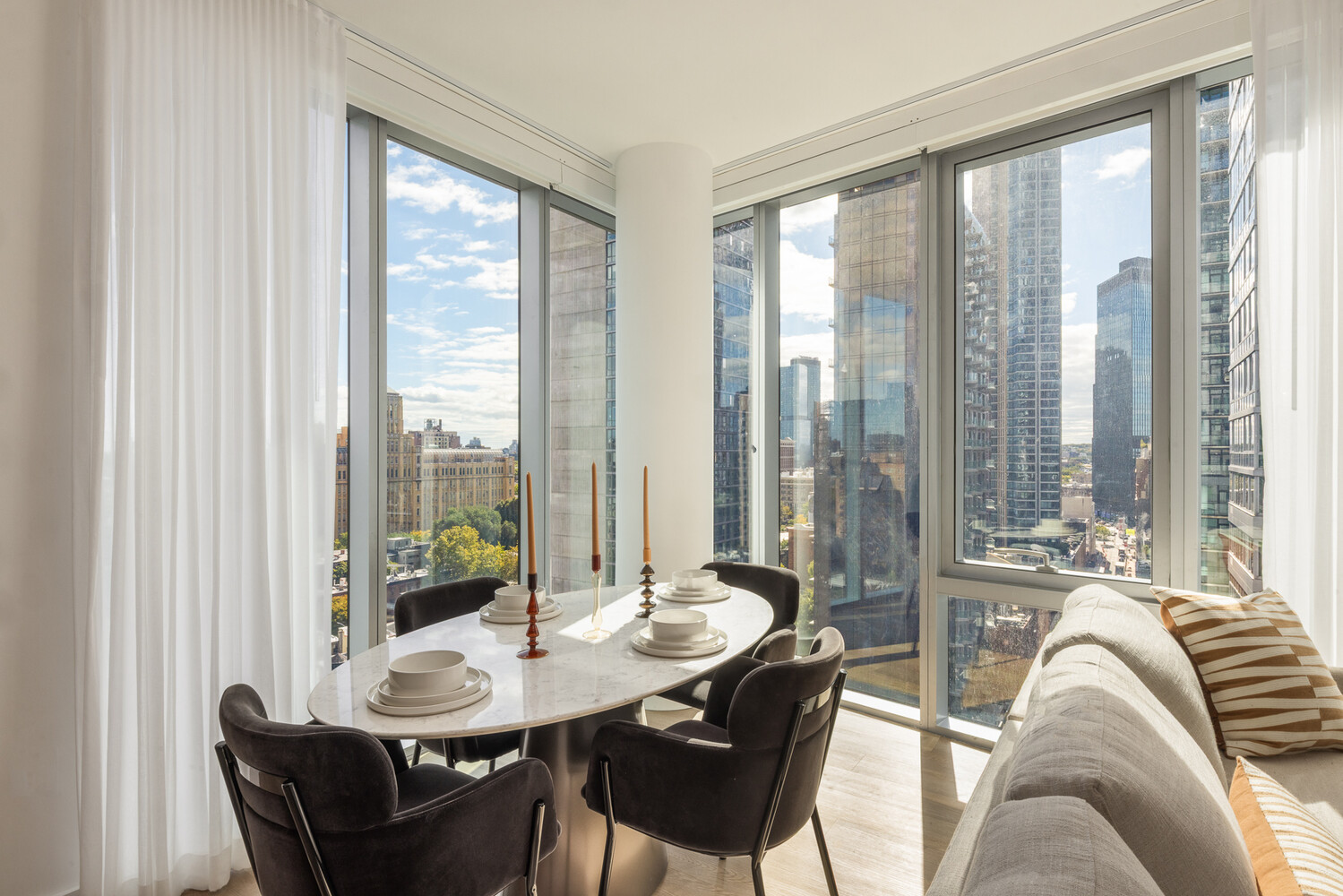 89 DeKalb Avenue, Unit 5Q Brooklyn, NY 11201 - Photo 2 of 18 a living room with furniture and a large window