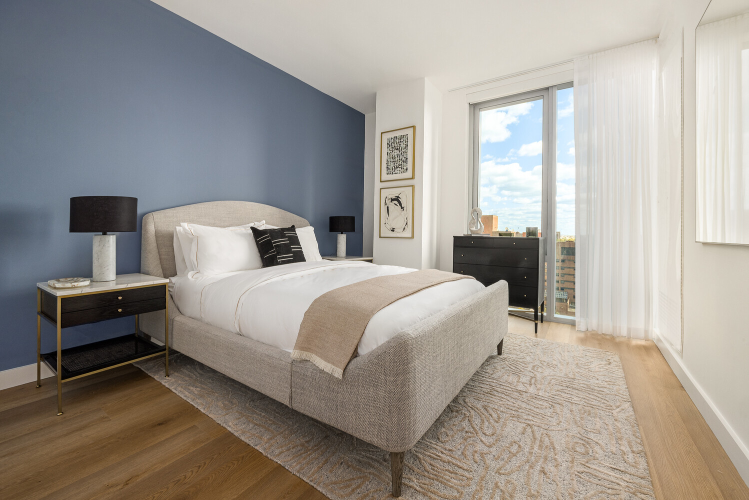 89 DeKalb Avenue, Unit 5Q Brooklyn, NY 11201 - Photo 4 of 18 a bedroom with a bed and a window