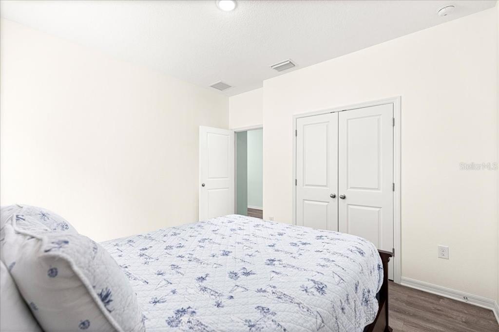 5851 Southwest 85th Place Ocala, FL 34476 - Photo 30 of 57 a bedroom with a bed and a window