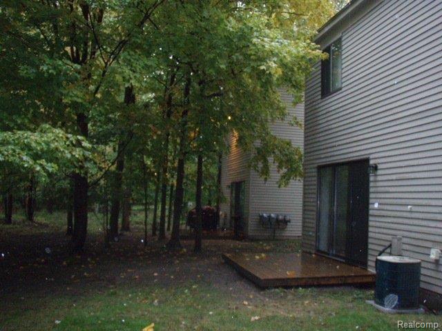 1554 Streamwood Court Rochester, MI 48307 - Photo 1 of 6 Back with Deck.jpg