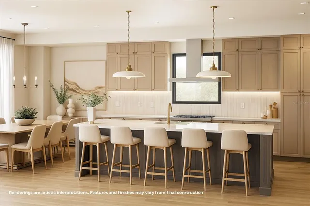 a view of kitchen with granite countertop cabinets table and chairs