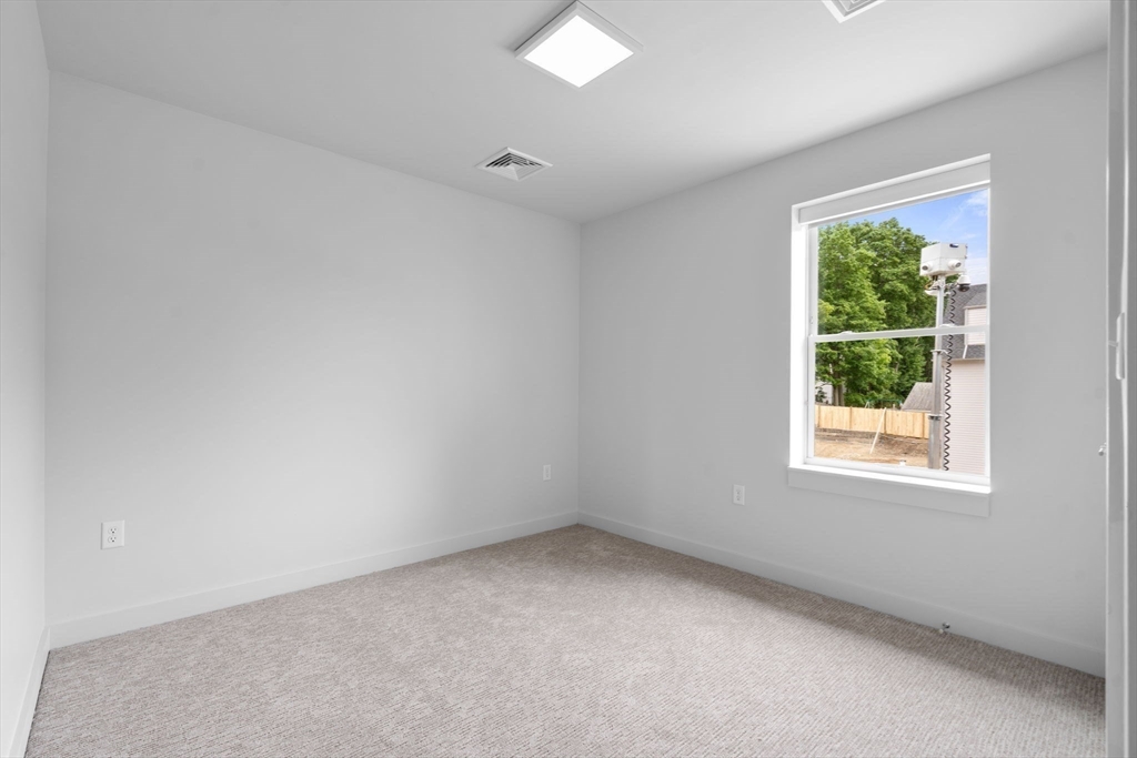 3 B Wilson Street, Unit 3B Natick, MA 01760 - Photo 22 of 33 an empty room with a window