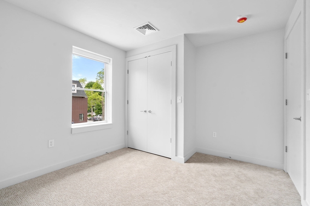 3 B Wilson Street, Unit 3B Natick, MA 01760 - Photo 23 of 33 a view of an empty room with a window