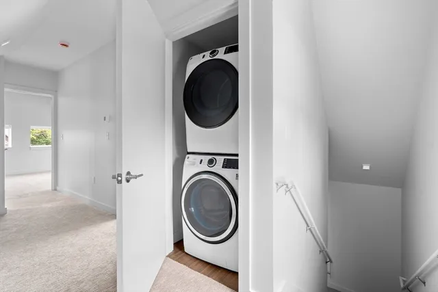 a view of a hallway with washer and dryer