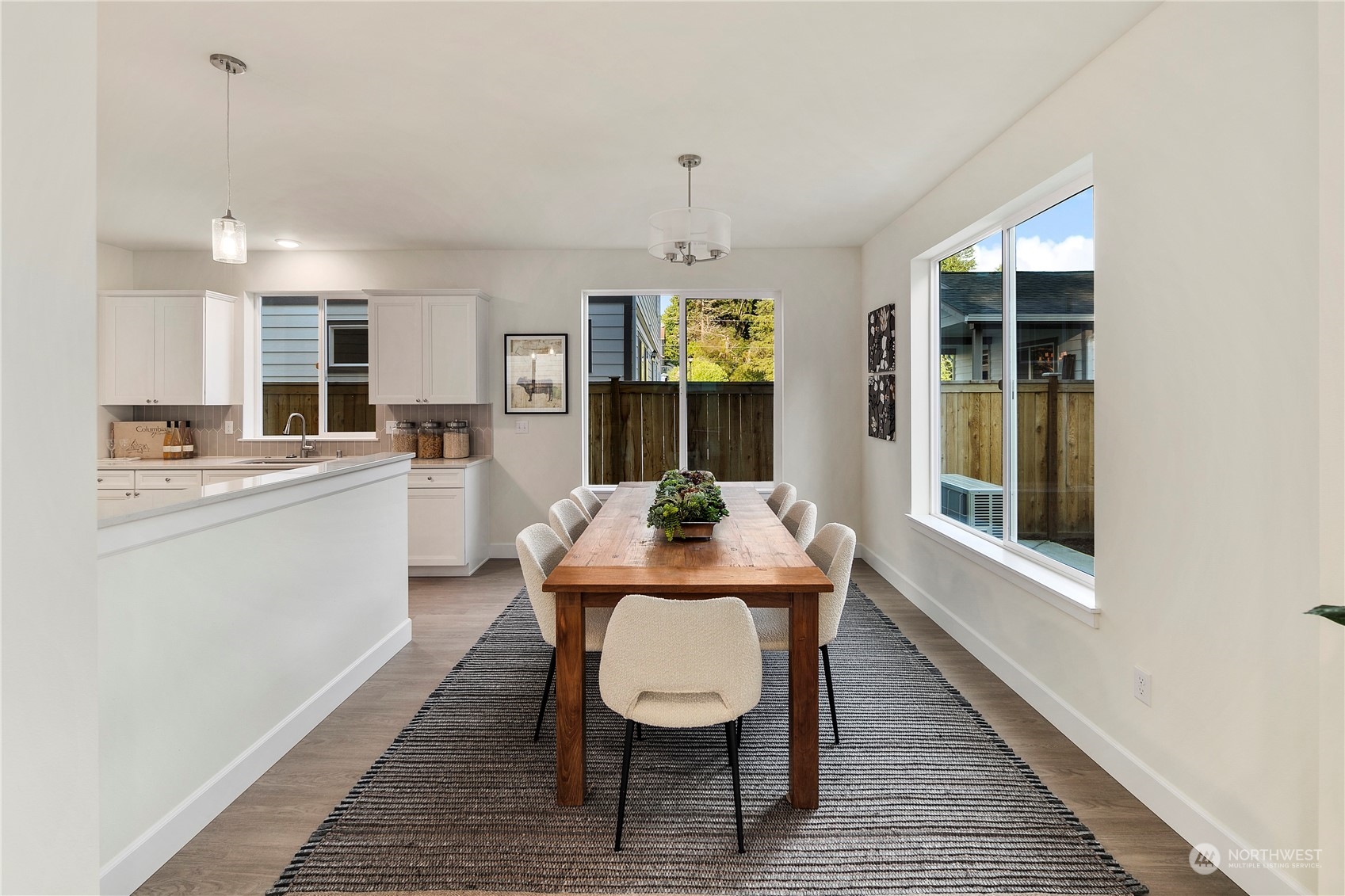 10969 Lot 8 Se 165th Street Renton, WA 98055 - Photo 14 of 38 a view of a dining room with furniture window and wooden floor