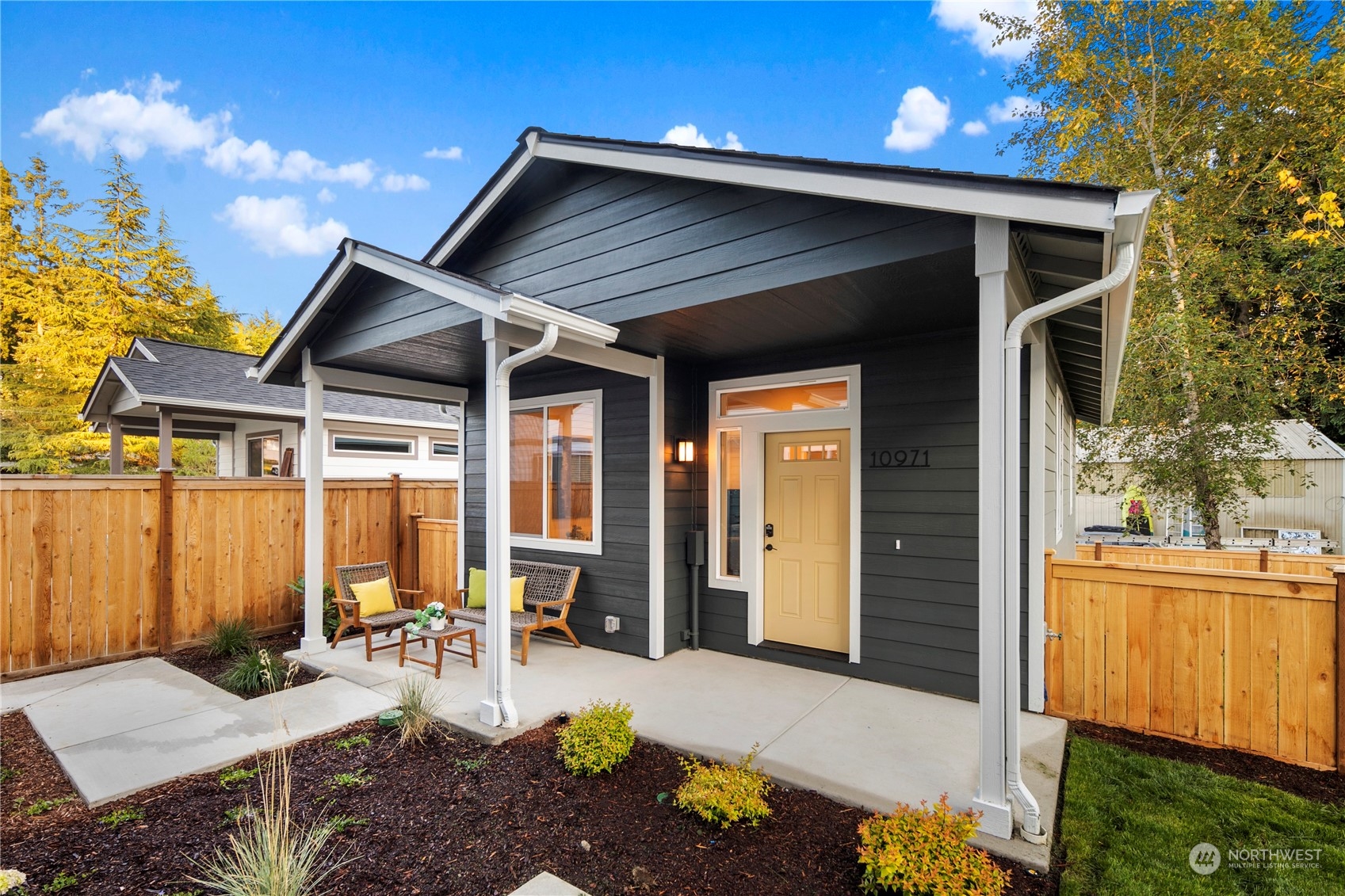 10969 Lot 8 Se 165th Street Renton, WA 98055 - Photo 28 of 38 a view of house with backyard outdoor seating and wooden fence
