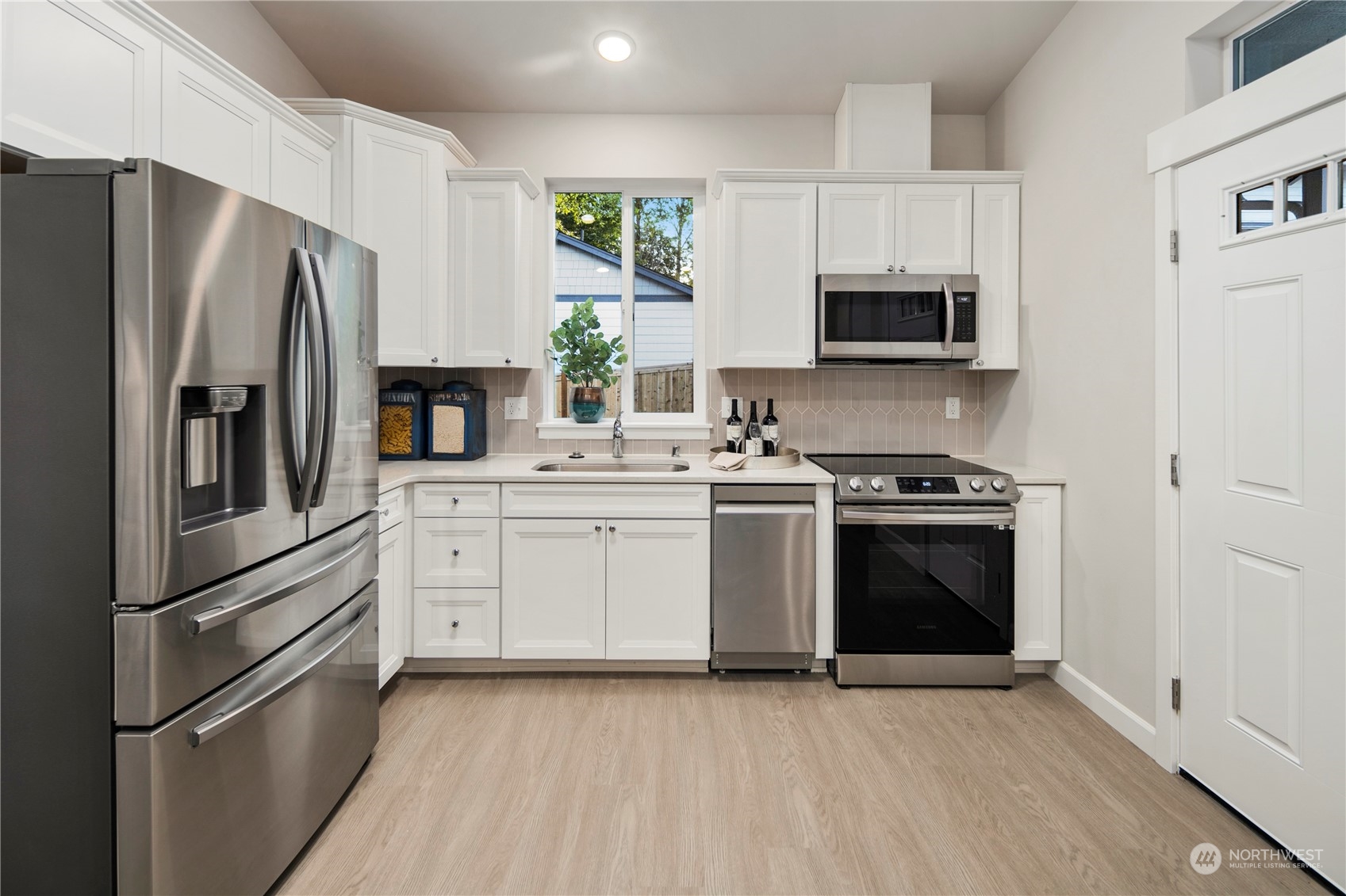 10969 Lot 8 Se 165th Street Renton, WA 98055 - Photo 30 of 38 a kitchen with stainless steel appliances a refrigerator stove and microwave