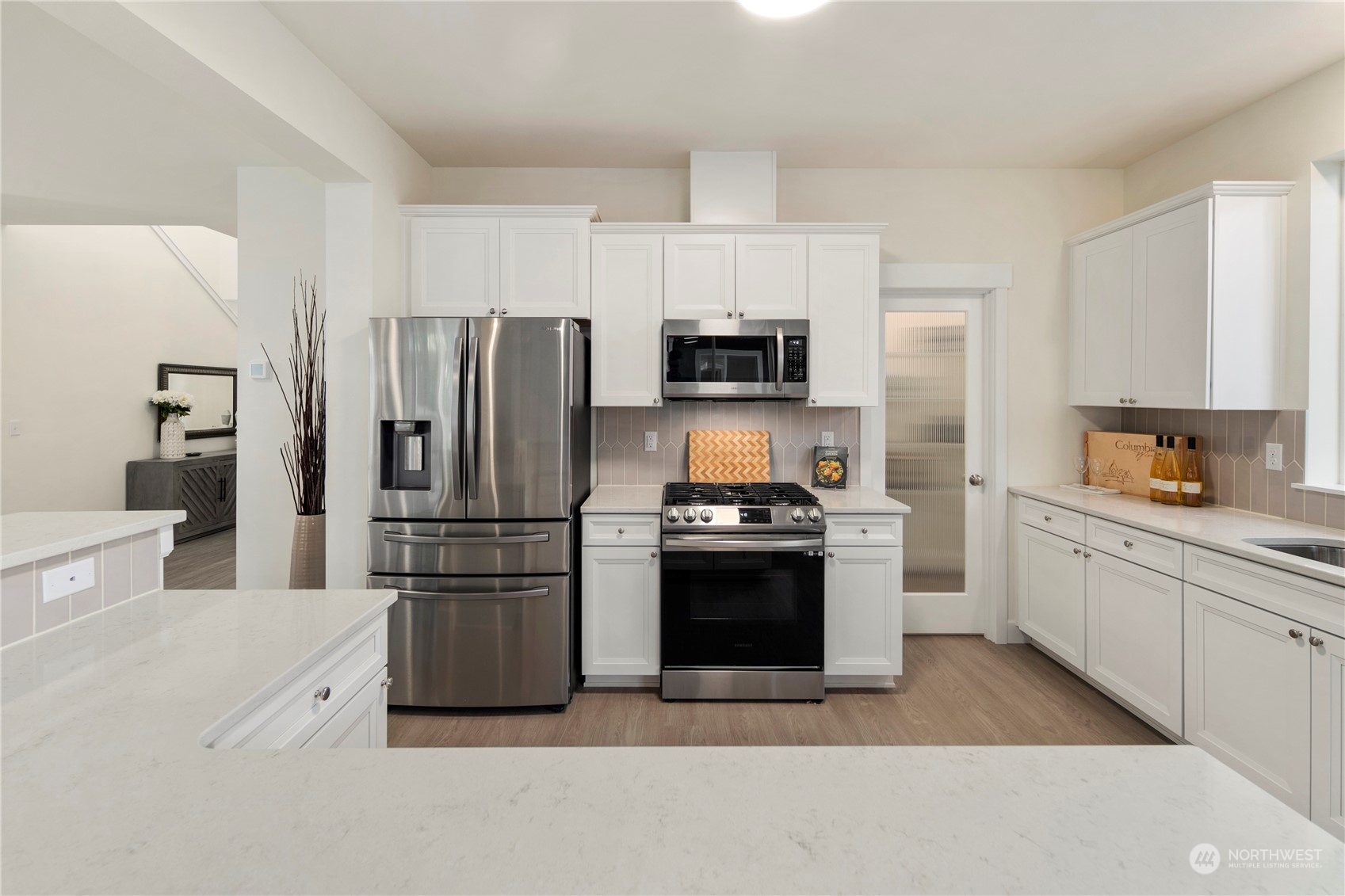 10969 Lot 8 Se 165th Street Renton, WA 98055 - Photo 10 of 38 a kitchen with stainless steel appliances a refrigerator stove and microwave