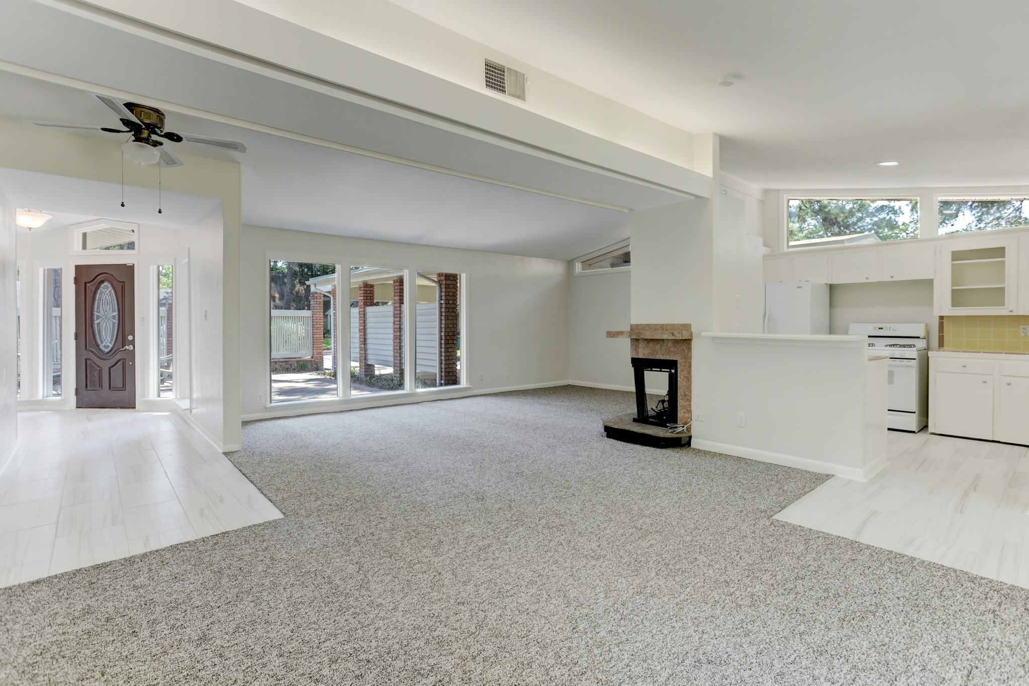 10226 Ivyridge Road Houston, TX 77043 - Photo 7 of 37 wooden floor in a room with a fireplace and cabinet