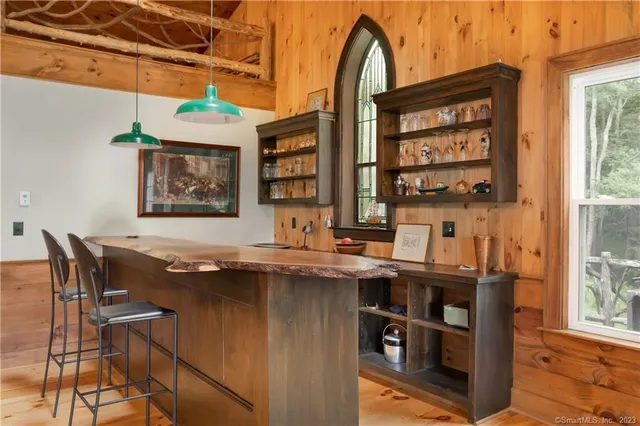 a view of a dining room with furniture and window