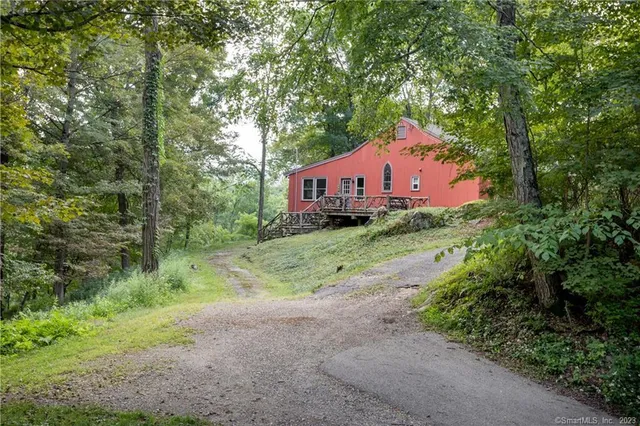 a house view with a backyard space