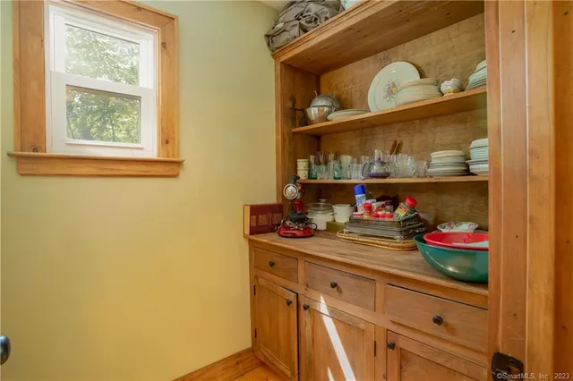 a kitchen with a refrigerator and cabinets
