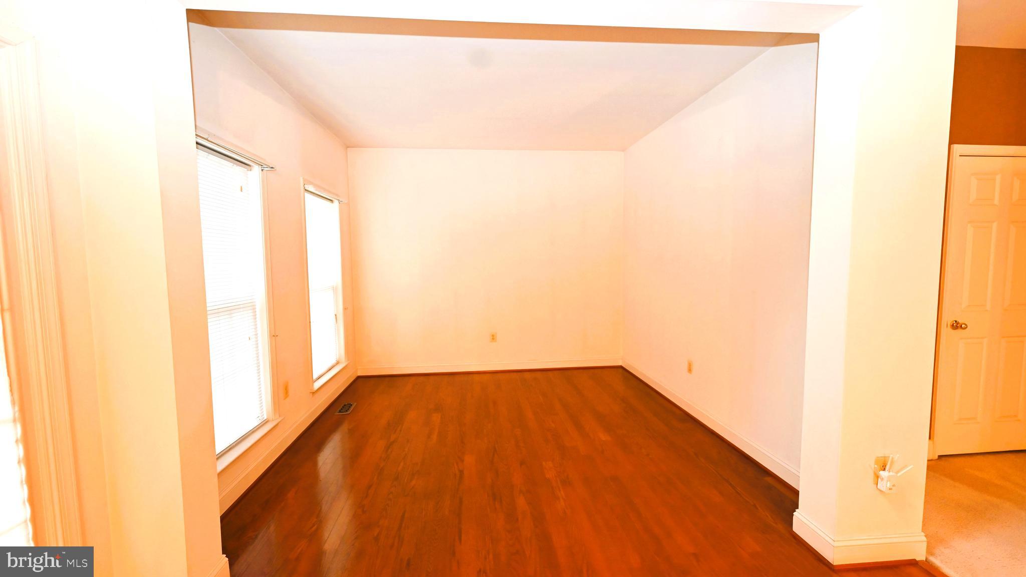 11258 Wildmeadows Street Waldorf, MD 20601 - Photo 11 of 33 a view of a big room with wooden floor and a window