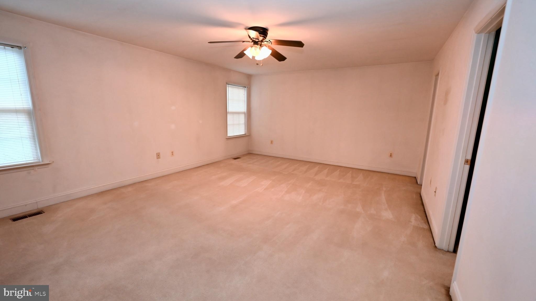 11258 Wildmeadows Street Waldorf, MD 20601 - Photo 13 of 33 an empty room with windows and fan