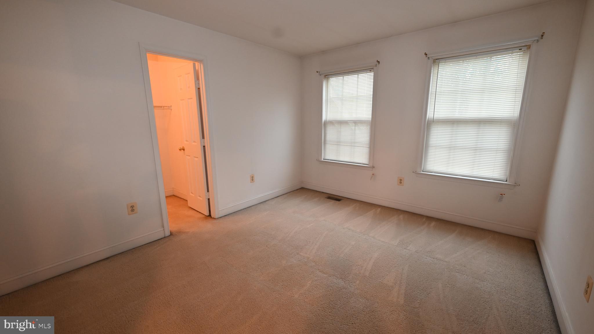 11258 Wildmeadows Street Waldorf, MD 20601 - Photo 17 of 33 an empty room with windows and closet