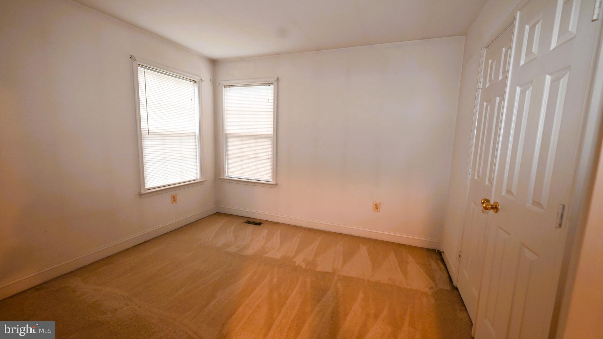 11258 Wildmeadows Street Waldorf, MD 20601 - Photo 18 of 33 an empty room with windows