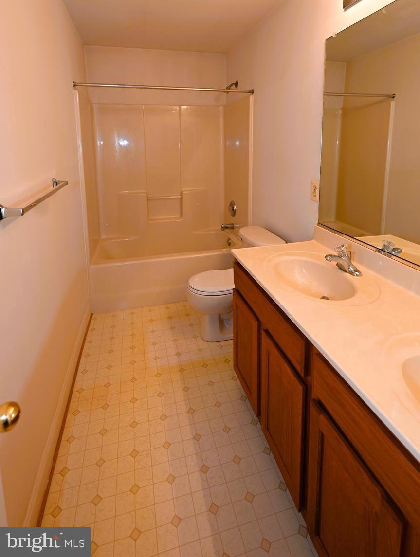 11258 Wildmeadows Street Waldorf, MD 20601 - Photo 19 of 33 a bathroom with a sink a toilet and shower