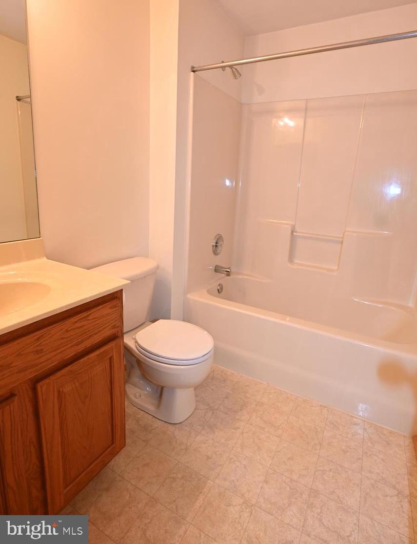 11258 Wildmeadows Street Waldorf, MD 20601 - Photo 21 of 33 a bathroom with a toilet a sink and a shower