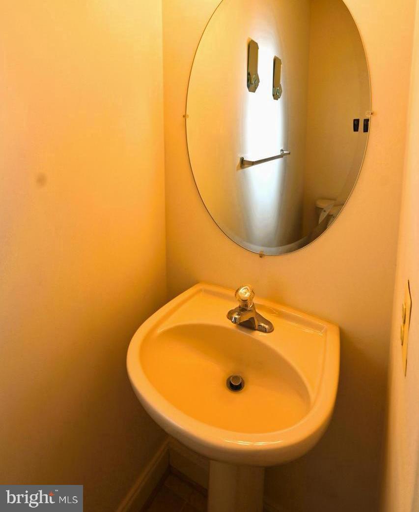 11258 Wildmeadows Street Waldorf, MD 20601 - Photo 22 of 33 a bathroom with a sink and mirror