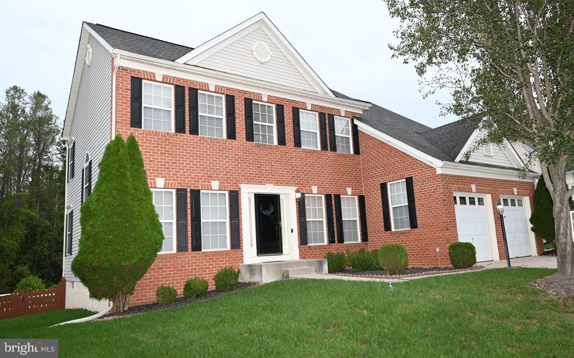 11258 Wildmeadows Street Waldorf, MD 20601 - Photo 33 of 33 a front view of a house with a yard and porch