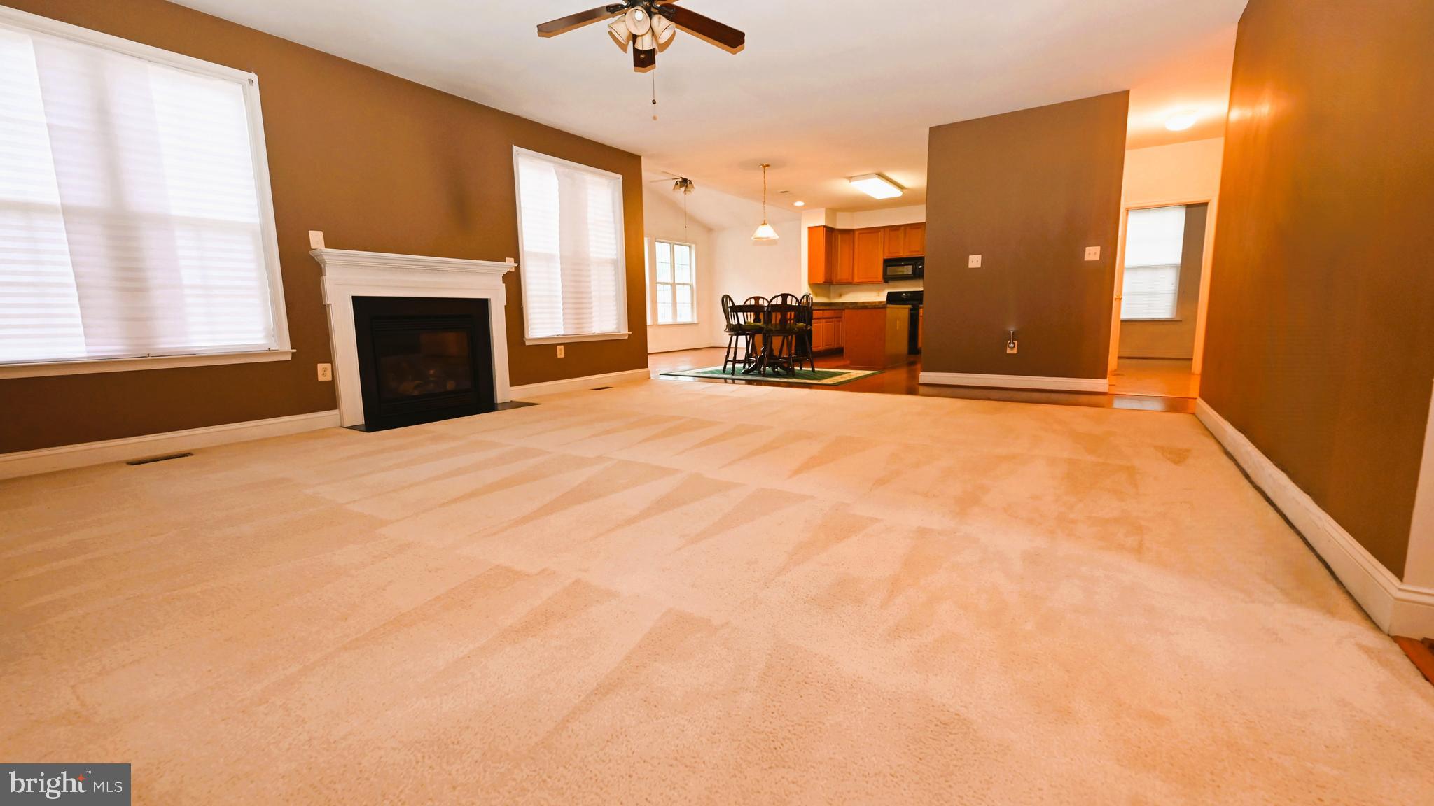 11258 Wildmeadows Street Waldorf, MD 20601 - Photo 7 of 33 a view of kitchen with furniture and a fireplace