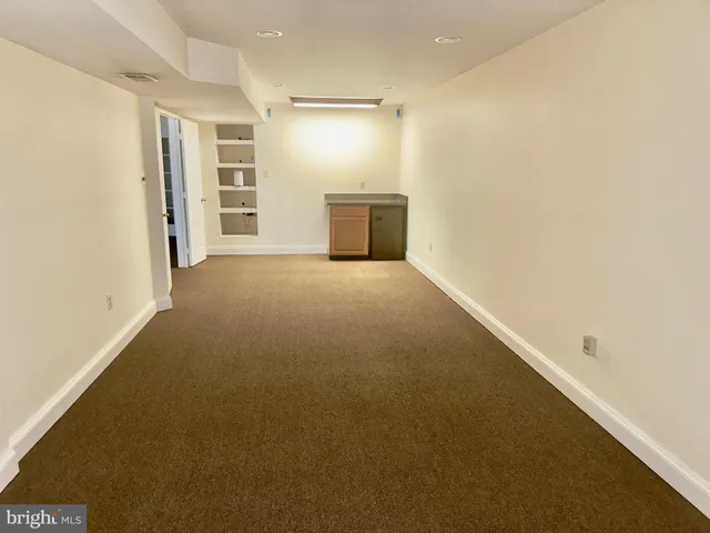 a view of a room with closet and windows