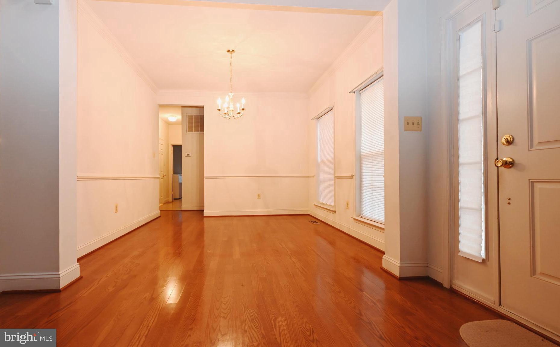 11258 Wildmeadows Street Waldorf, MD 20601 - Photo 10 of 33 an empty room with wooden floor and a window