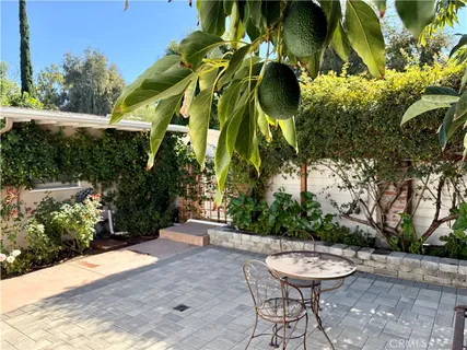 a view of a backyard with sitting area