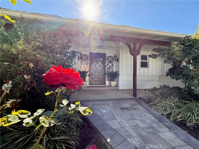 a view of a swimming pool with a yard