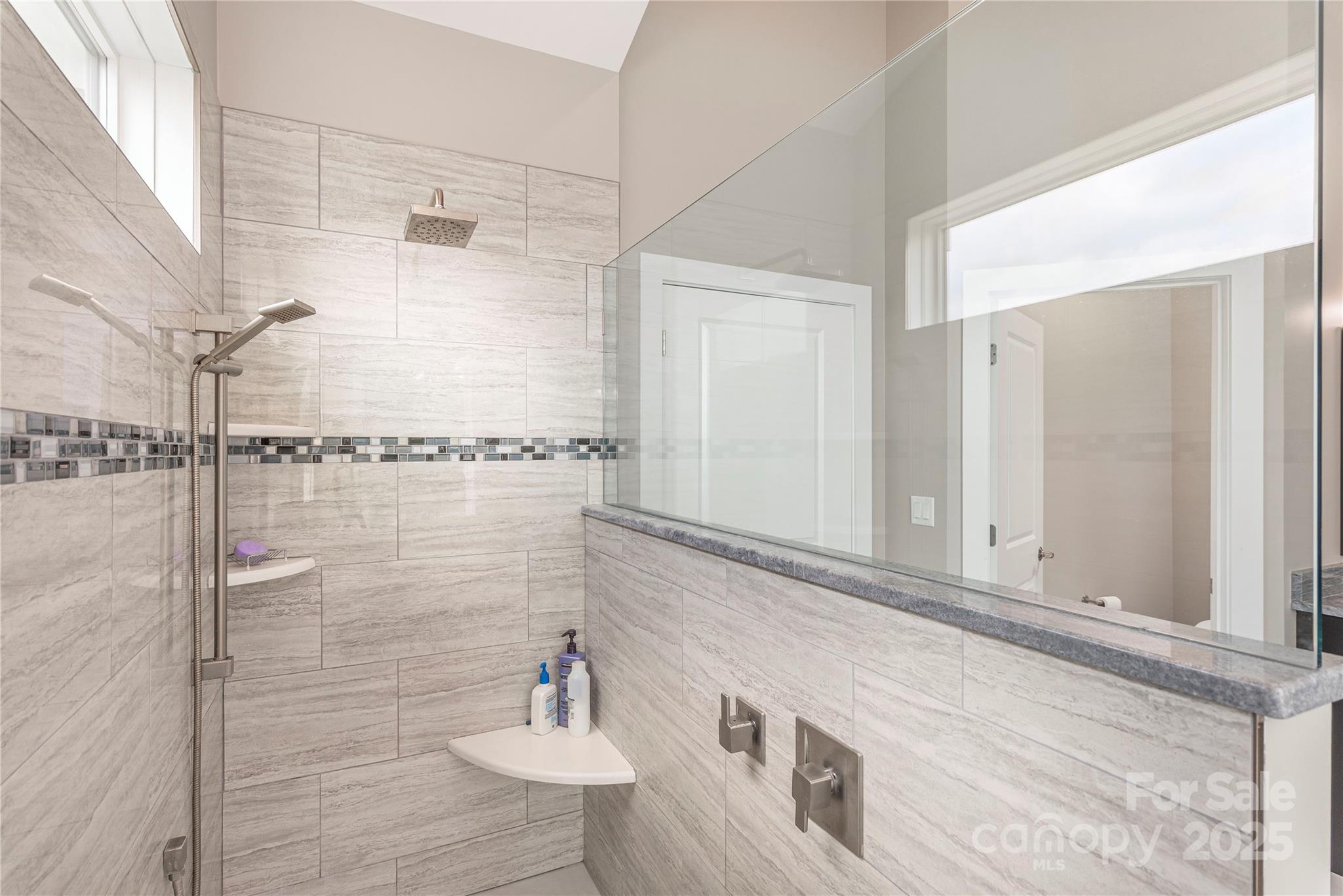 930 Big Raven Lane Saluda, NC 28773 - Photo 22 of 35 a bathroom with a sink and a mirror