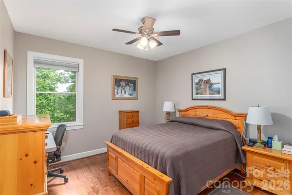 a bedroom with a bed and a table in it