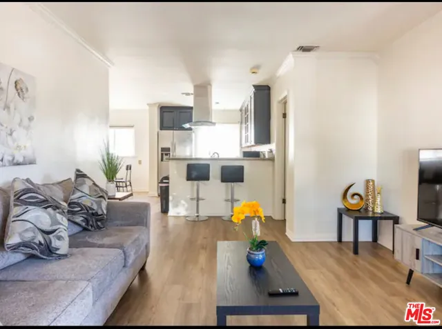 a living room with furniture and a table