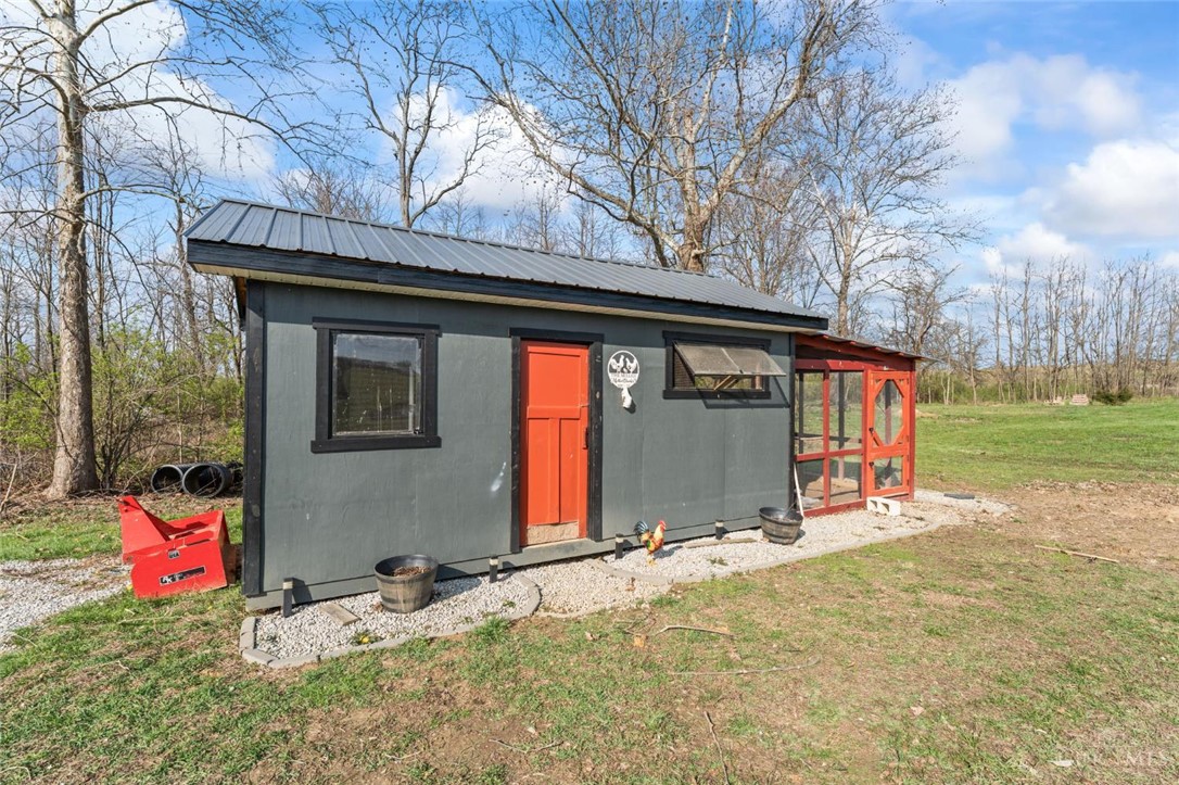 2425 Middleboro Road Clarksville, OH 45113 - Photo 15 of 91 This structure with a metal roof is ideal for various outdoor needs.