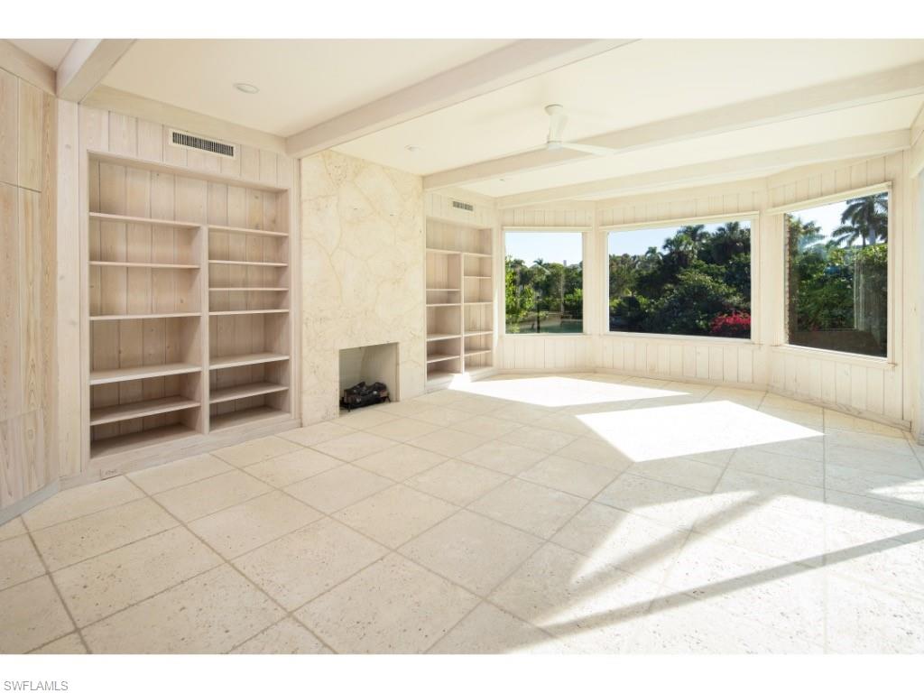 2610 Half Moon Walk Naples, FL 34102 - Photo 3 of 10 a view of an empty room with a window and kitchen view