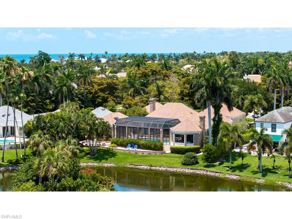 2610 Half Moon Walk Naples, FL 34102 - Photo 8 of 10 a view of house with a yard