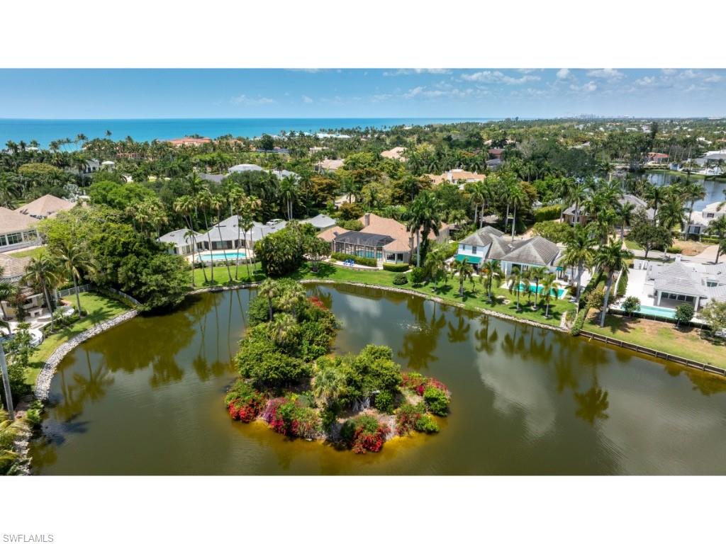 2610 Half Moon Walk Naples, FL 34102 - Photo 9 of 10 a view of a lake with a city