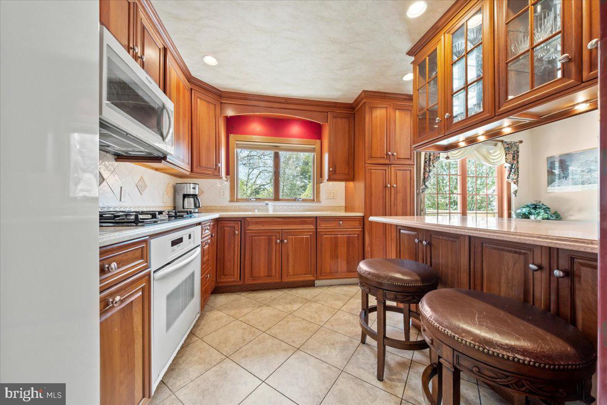 12 Green Tree Road Stratford, NJ 08084 - Photo 12 of 33 a kitchen with a sink cabinets and appliances