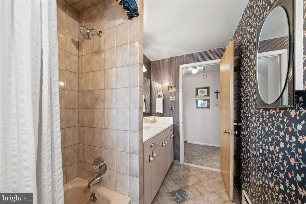 12 Green Tree Road Stratford, NJ 08084 - Photo 21 of 33 a bathroom with a sink and a mirror