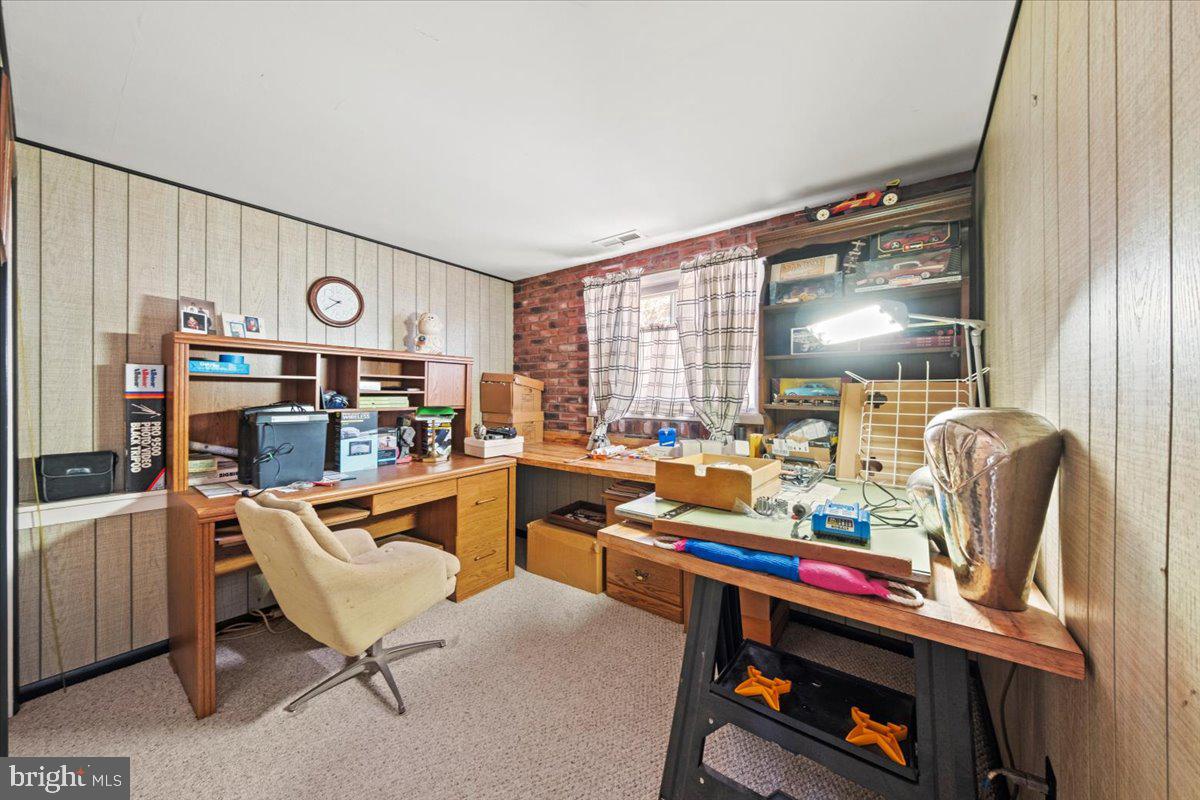 12 Green Tree Road Stratford, NJ 08084 - Photo 26 of 33 a view of a workspace with furniture and a bookshelf