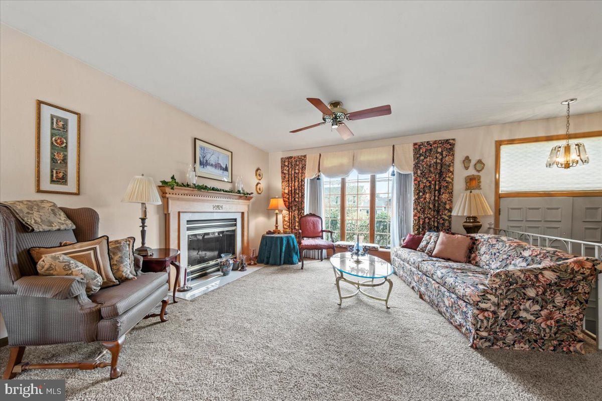 12 Green Tree Road Stratford, NJ 08084 - Photo 4 of 33 a living room with furniture and a fireplace