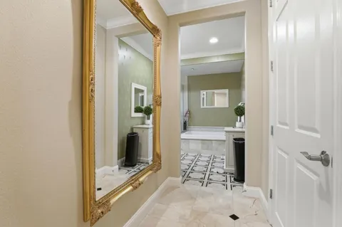 a view of a bathroom with a glass door and shower