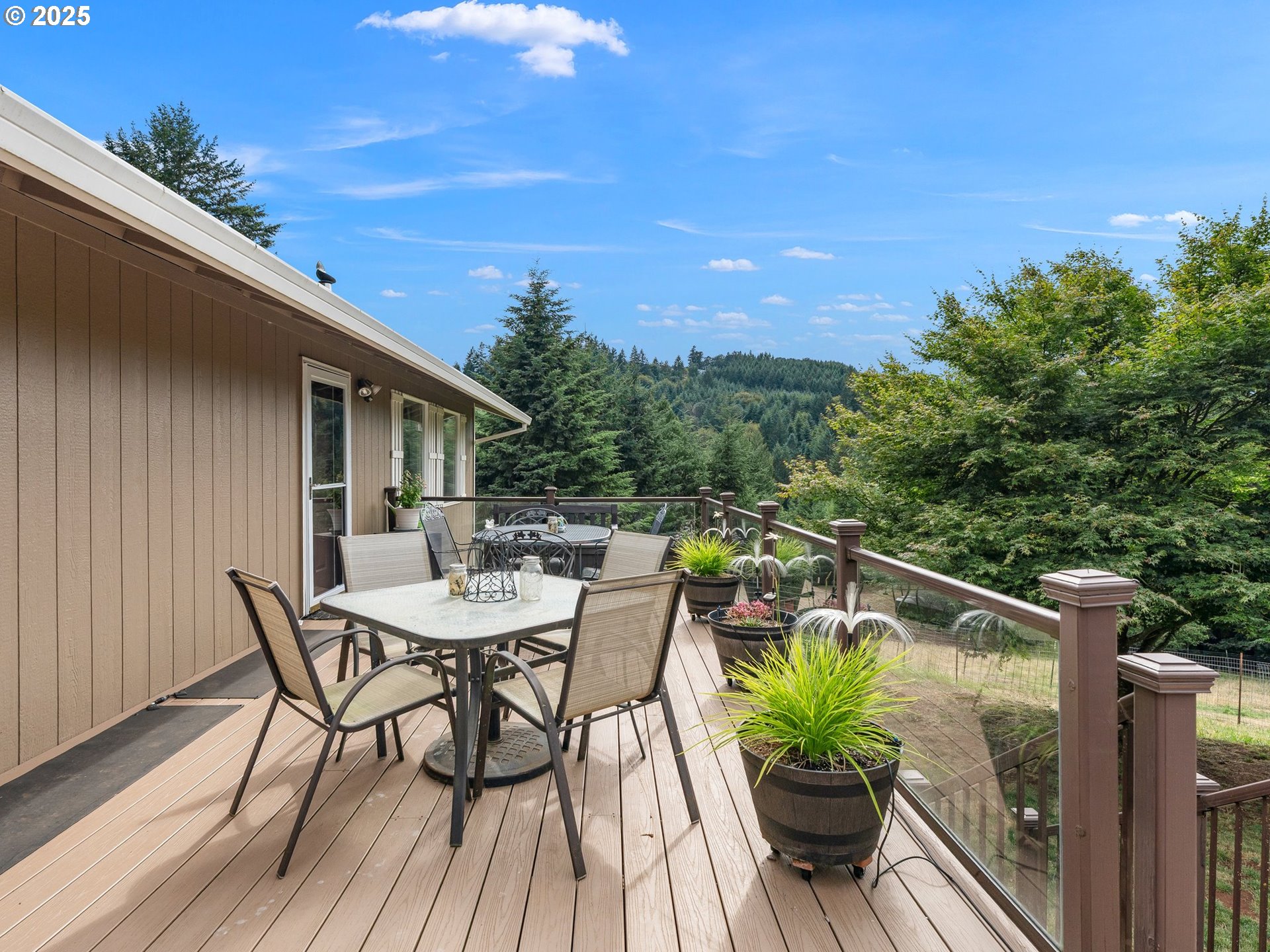 19791 Northeast Sunnycrest Road Newberg, OR 97132 - Photo 17 of 40 a view of a balcony with furniture and a potted plant
