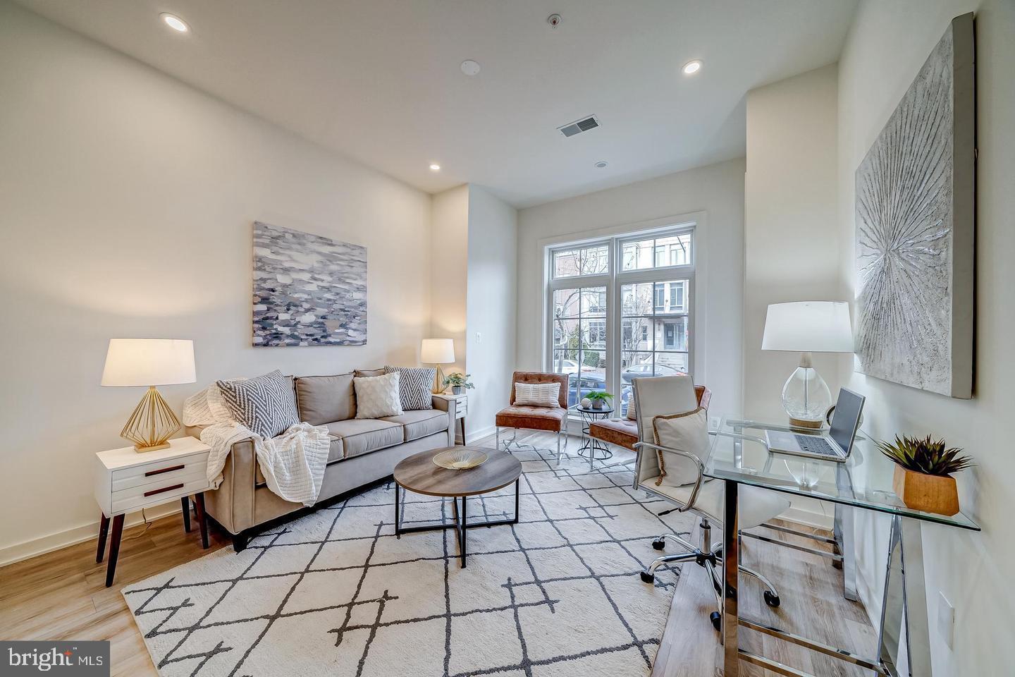 442 R Street Northwest, Unit A Washington, DC 20001 - Photo 11 of 25 a living room with furniture a lamp and a window
