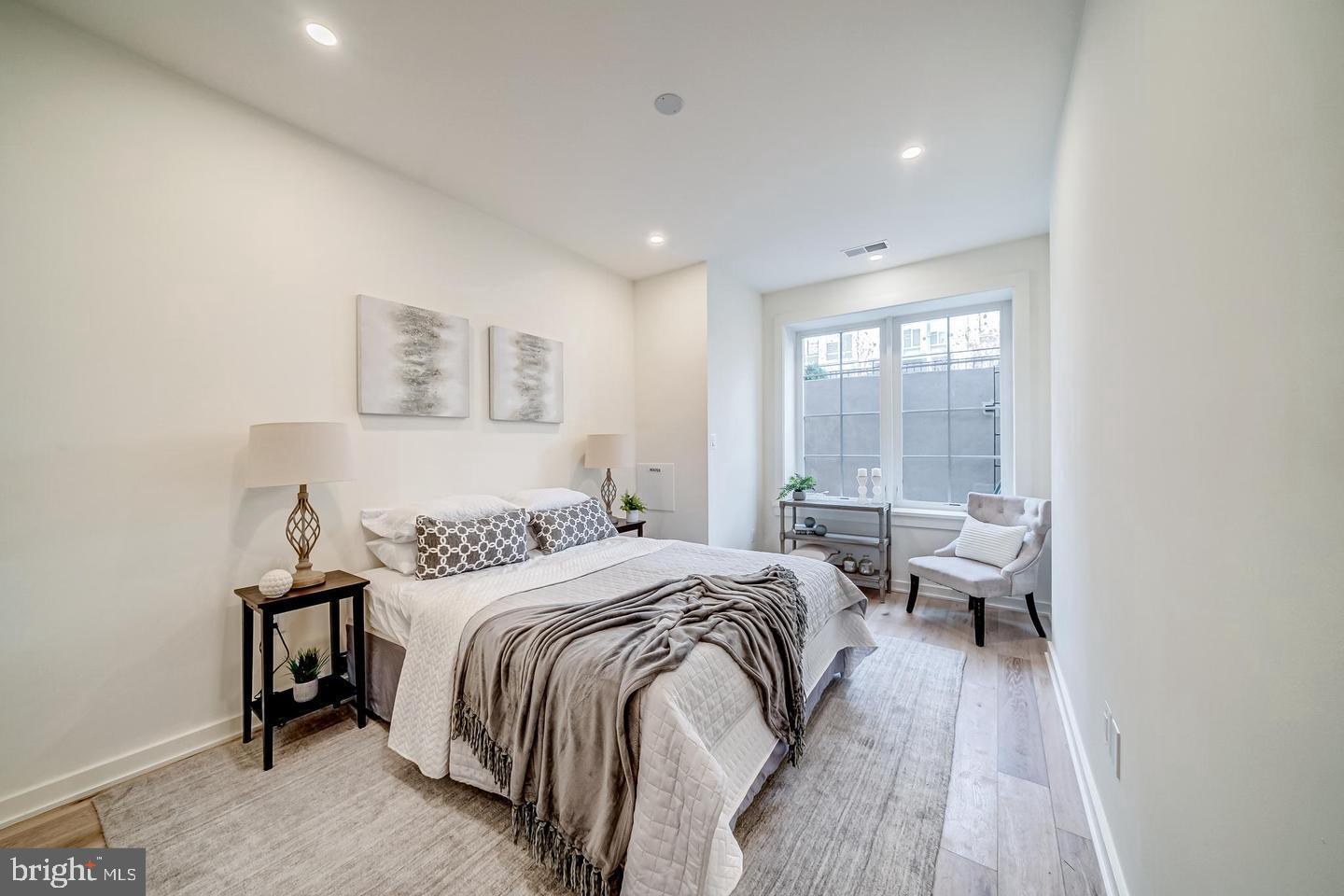 442 R Street Northwest, Unit A Washington, DC 20001 - Photo 15 of 25 a bedroom with a bed and wooden floor