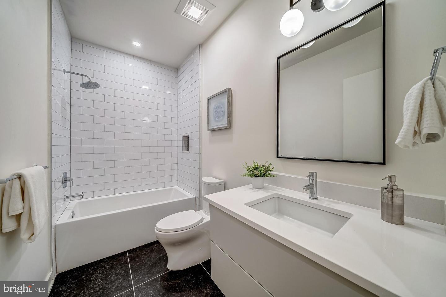 442 R Street Northwest, Unit A Washington, DC 20001 - Photo 16 of 25 a bathroom with a sink toilet tub and shower
