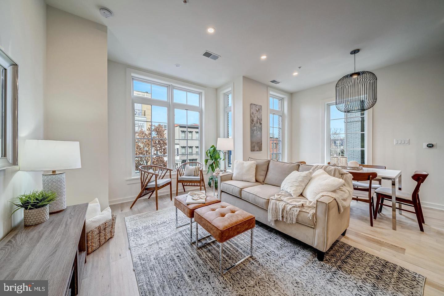 442 R Street Northwest, Unit A Washington, DC 20001 - Photo 4 of 25 a living room with furniture potted plant and a large window