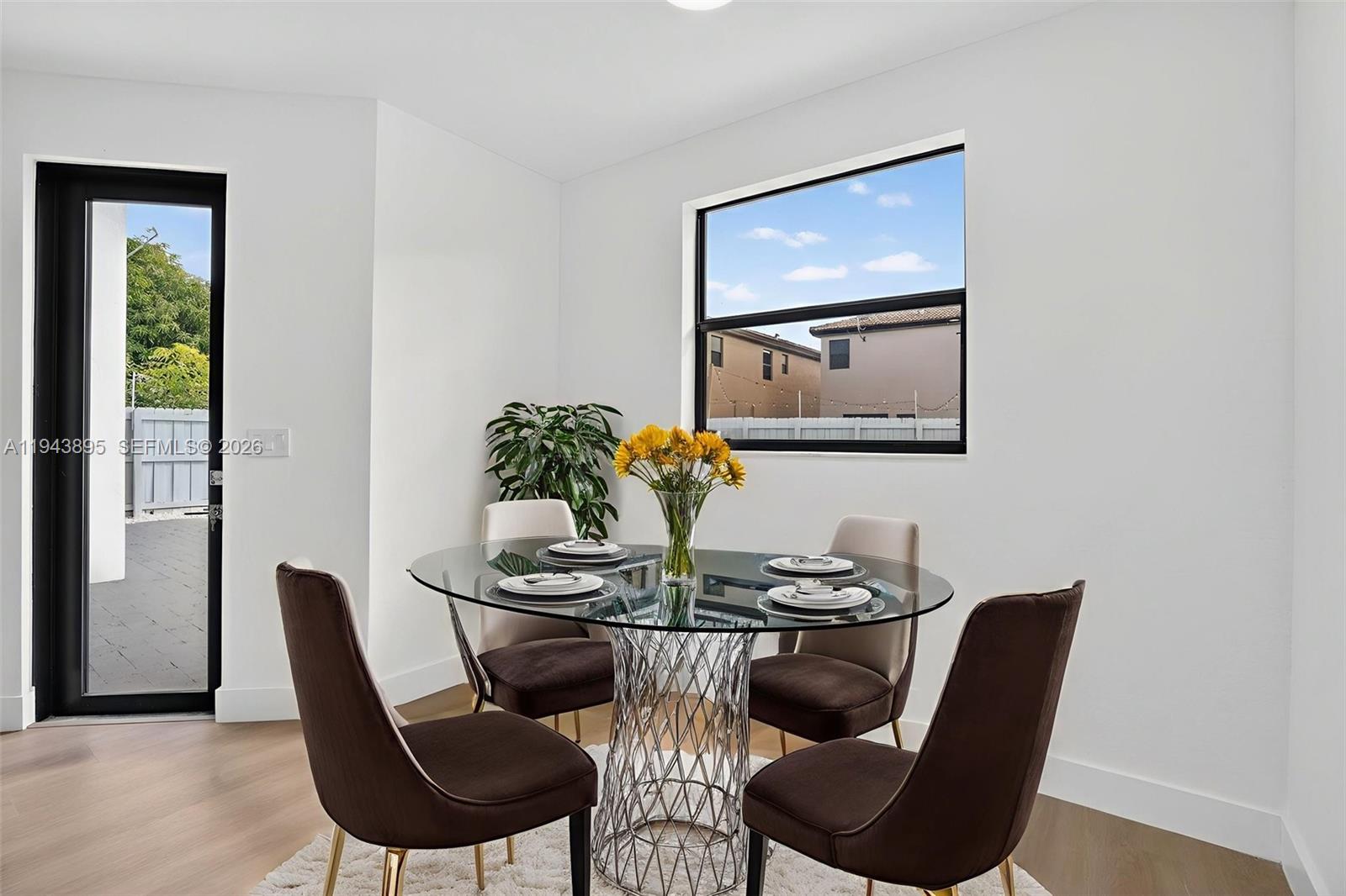 11556 Southwest 234th Street Homestead, FL 33032 - Photo 16 of 44 a dining room with furniture and window